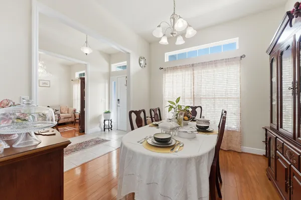 a view of a dining room with furniture window and wooden floor