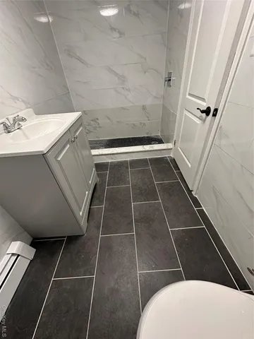 a bathroom with a sink toilet and tub