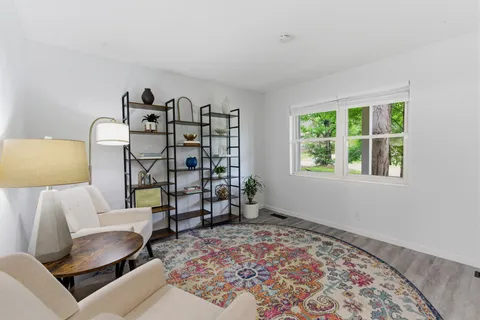 a bedroom with a bed and a couch