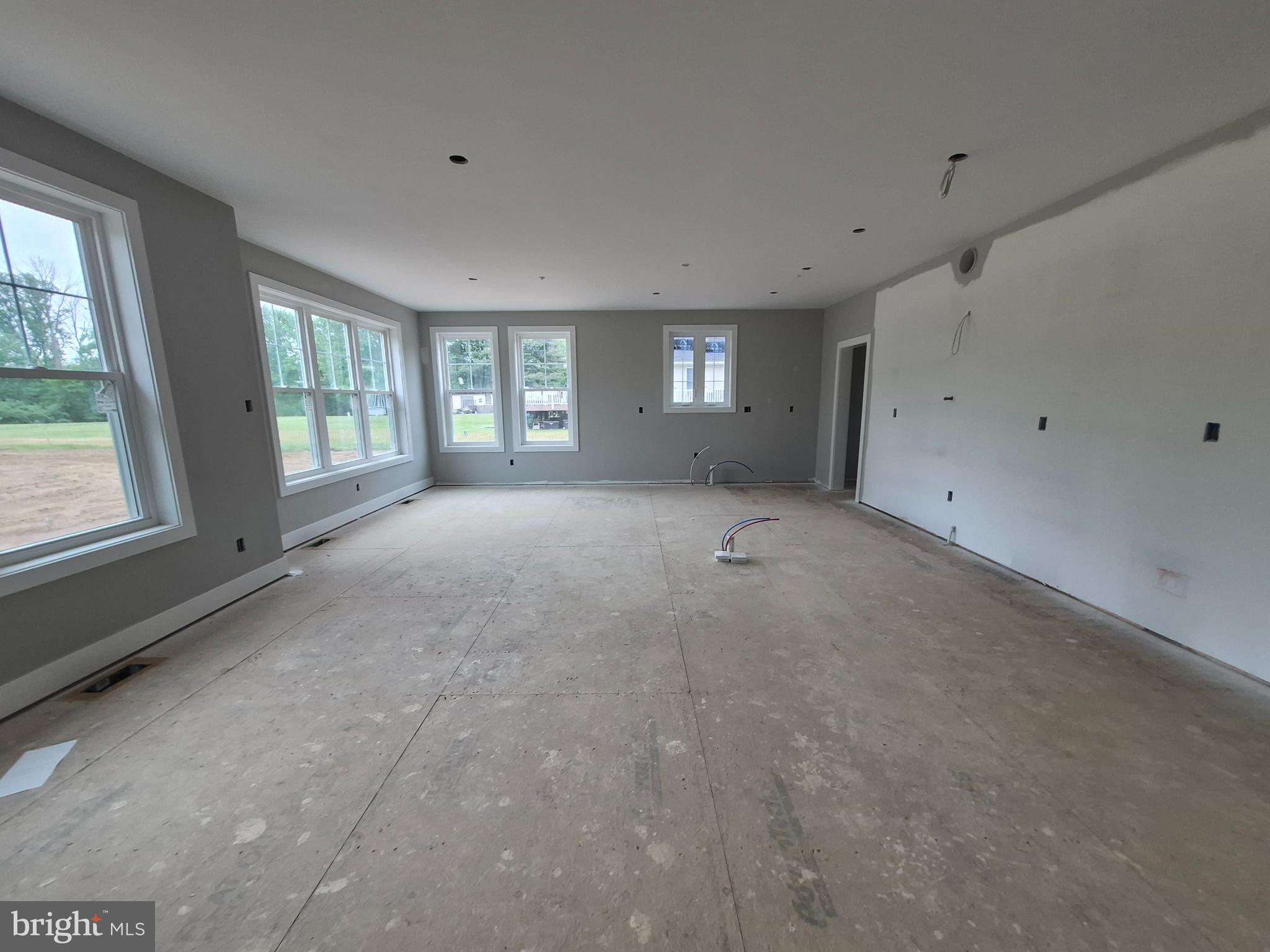 324 Bishop Hollow Road Newtown Square, PA 19073 - Photo 7 of 37 a view of an empty room with windows