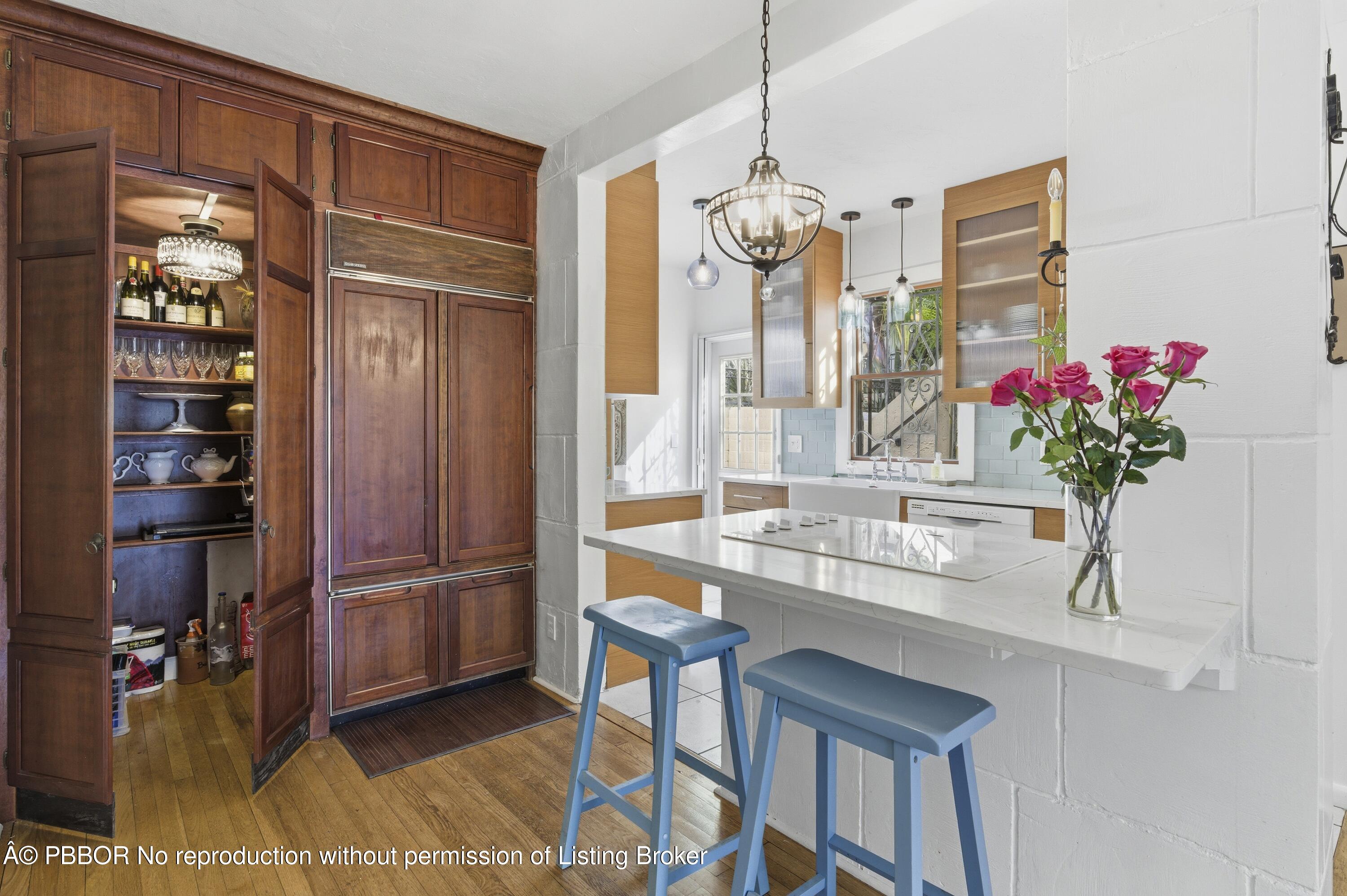 281 Granada Road West Palm Beach, FL 33401 - Photo 14 of 19 a dining room with furniture and chandelier