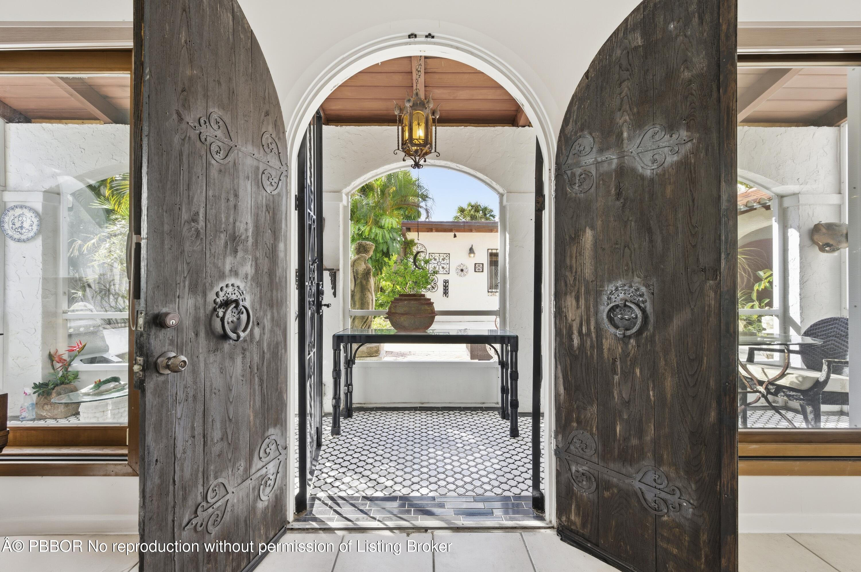 281 Granada Road West Palm Beach, FL 33401 - Photo 16 of 19 a bathroom with a glass door shower and a mirror
