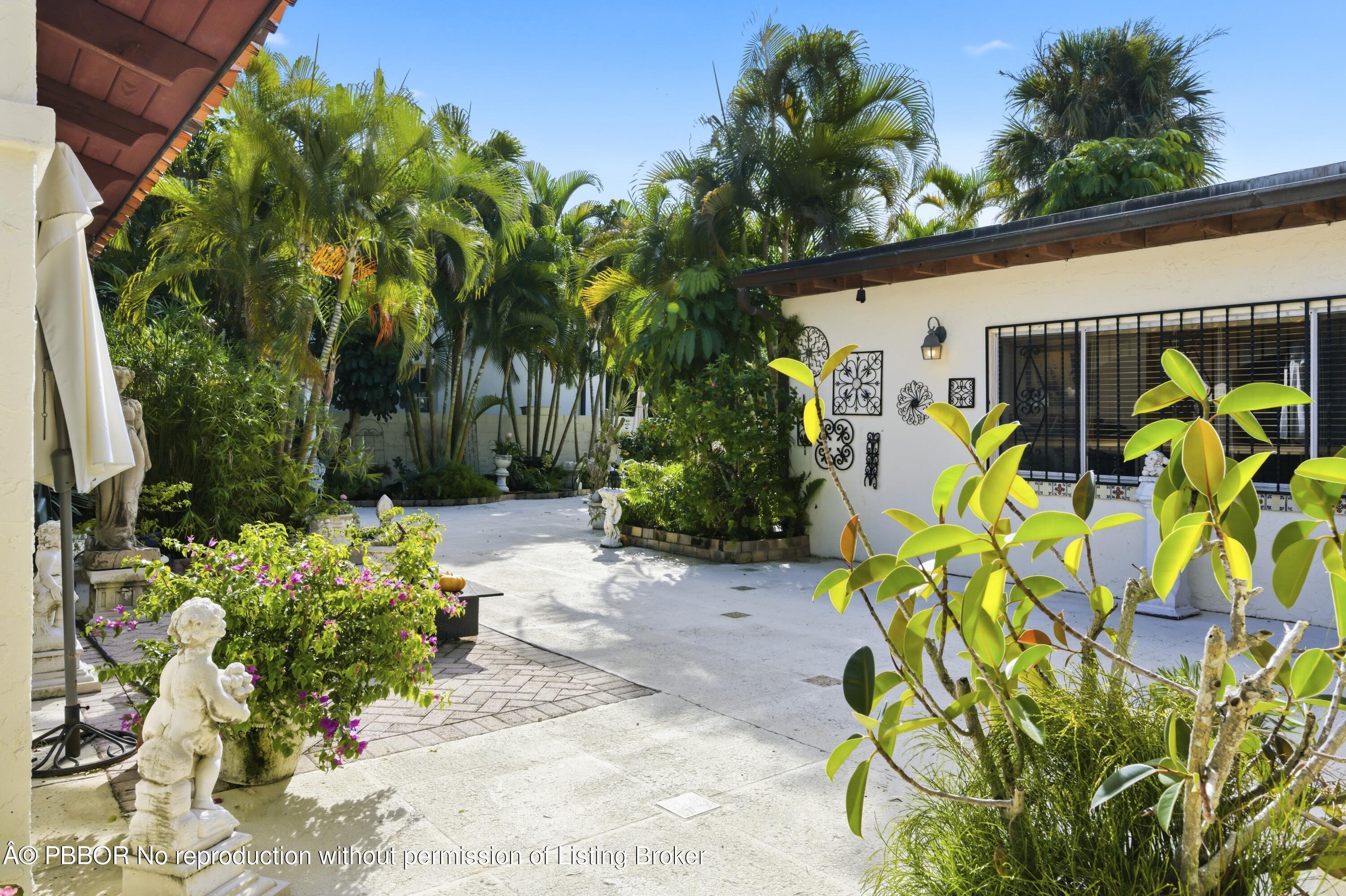 281 Granada Road West Palm Beach, FL 33401 - Photo 6 of 19 a view of a bunch of flowers