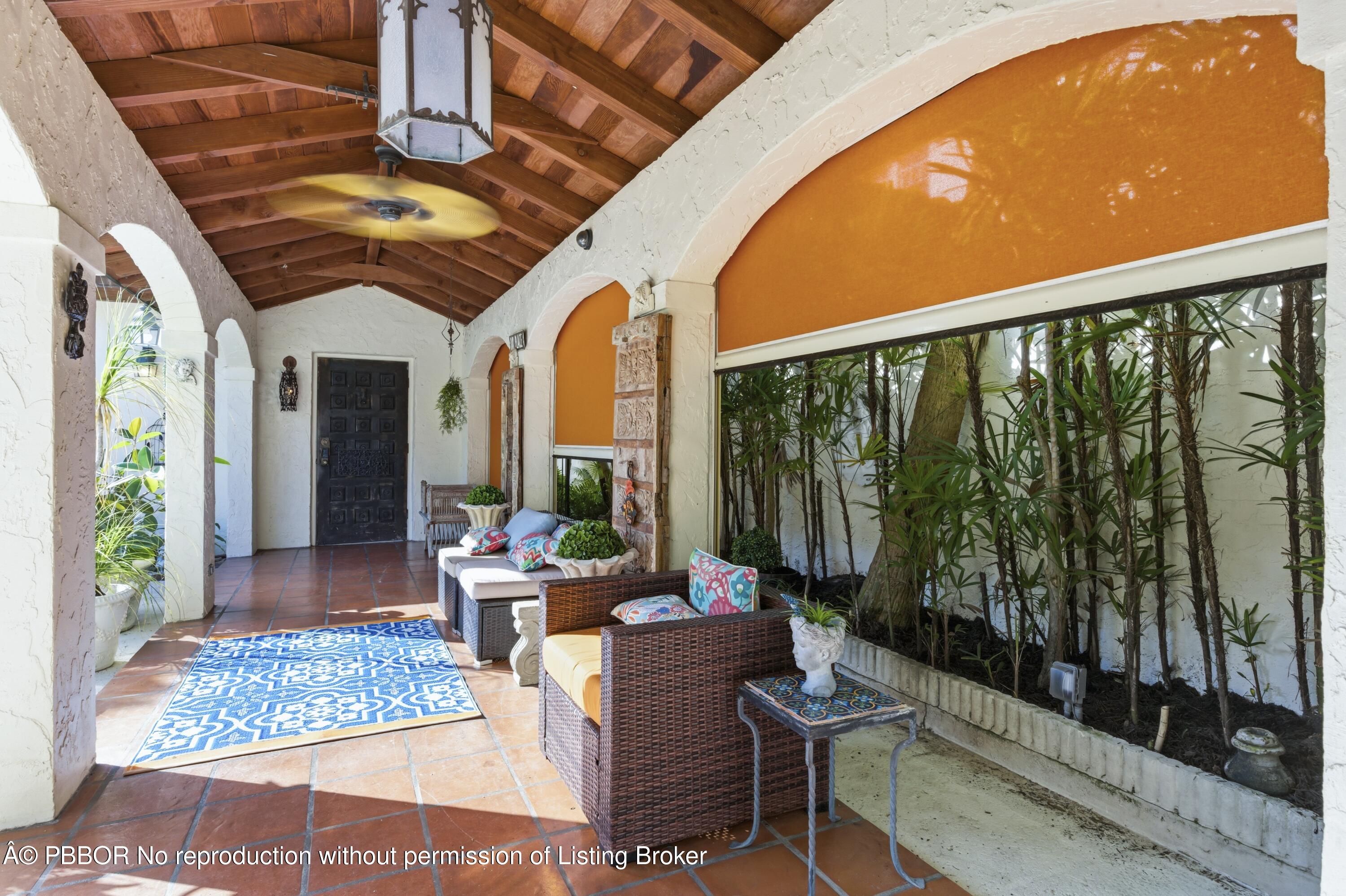 281 Granada Road West Palm Beach, FL 33401 - Photo 8 of 19 a living room with large windows and furniture