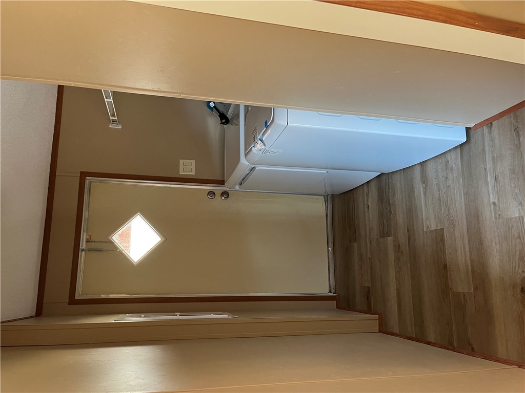 9855 Deer Ridge Lane Bryan, TX 77808 - Photo 4 of 8 a view of a hallway with wooden floor