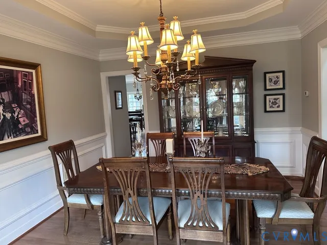 a kitchen with kitchen island granite countertop a stove sink and microwave