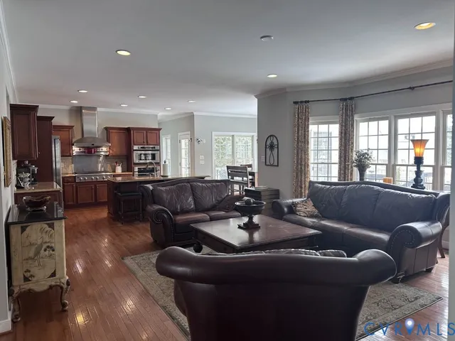 a kitchen with stainless steel appliances granite countertop a refrigerator and cabinets