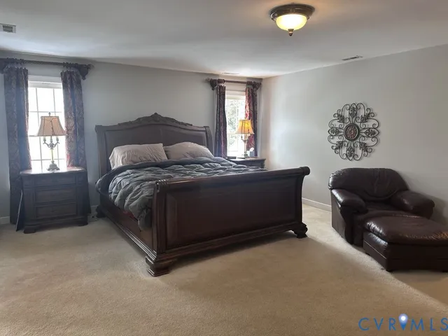 a bathroom with a tub a sink and glass door shower