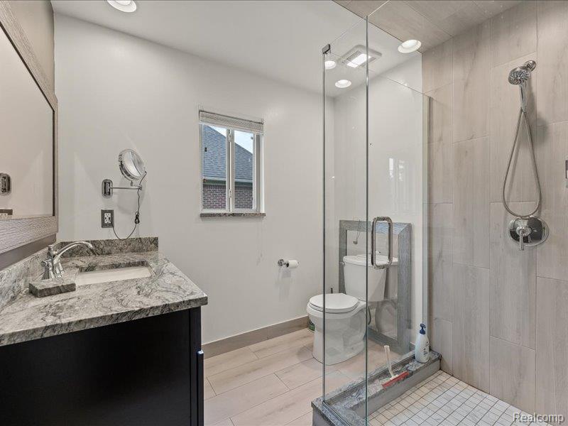 29213 Rachid Lane New Baltimore, MI 48047 - Photo 10 of 26 Full bathroom featuring vanity, a stall shower, and recessed lighting