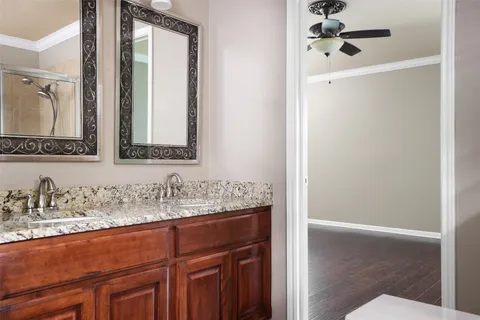 a bathroom with a tub sink and mirror