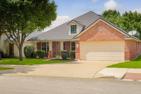 front view of a house and a yard