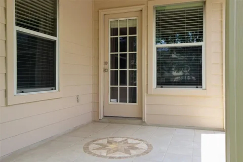 a front view of a house with yard and green space