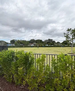 a view of a lake with houses in the back