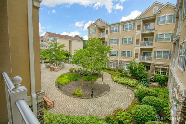 a view of a patio with plants and table and chairs and potted plants