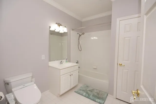 a view of a hallway with dining room and wooden floor