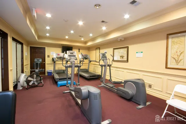 a room with pool table and a chandelier