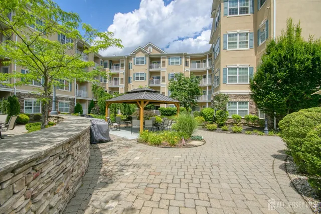 a view of a building with sitting area