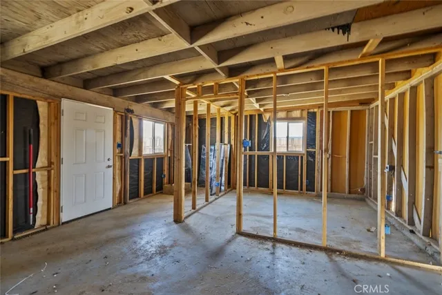 an empty room with a kitchen