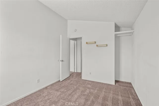 a view of wooden fence next to a yard