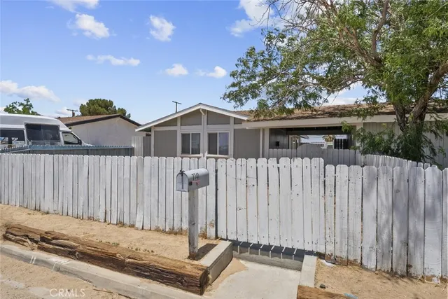 a house view with a garden space