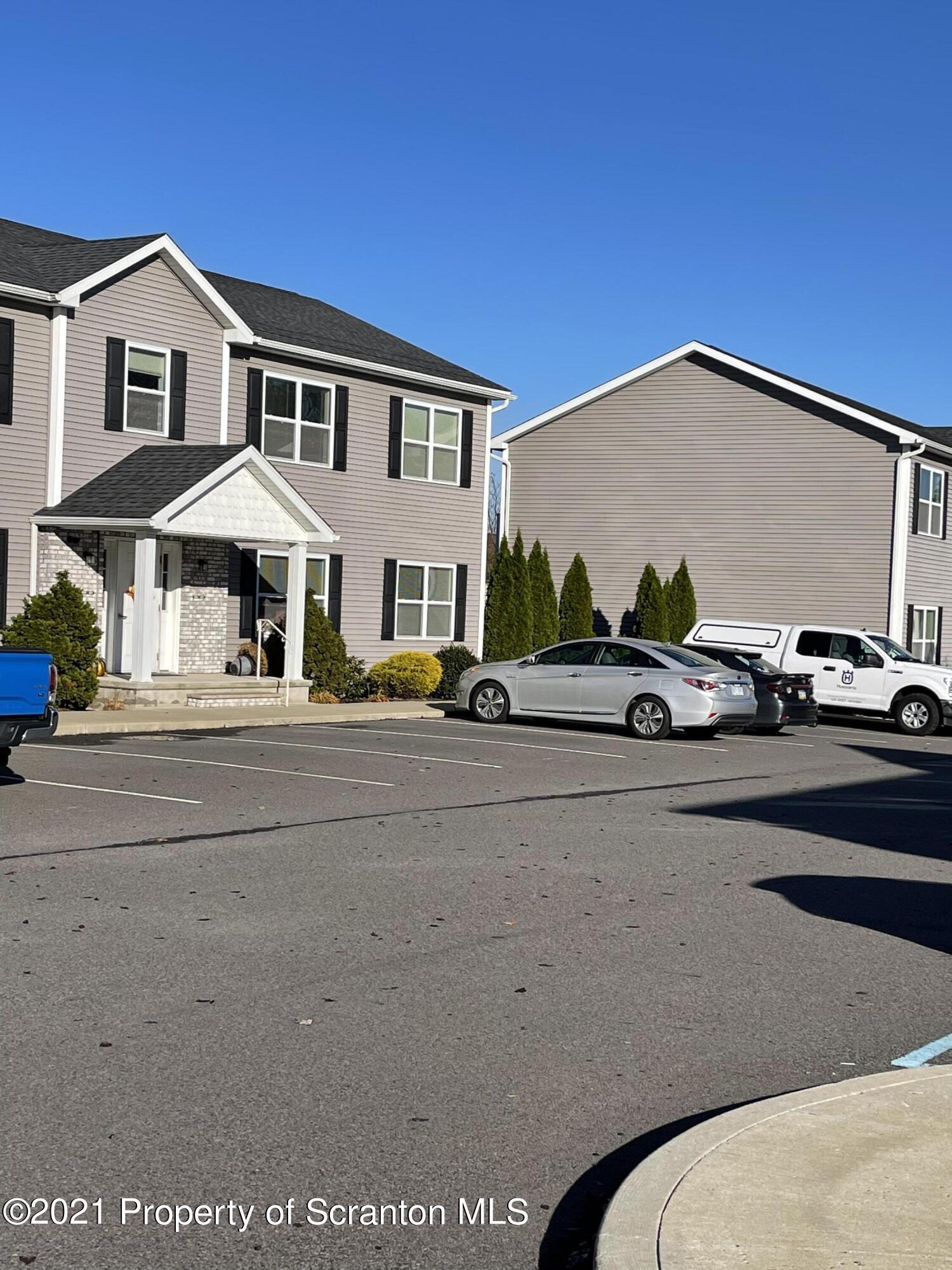 905 Ash Street Moosic, PA 18507 - Photo 6 of 7 a couple of cars parked in front of a house