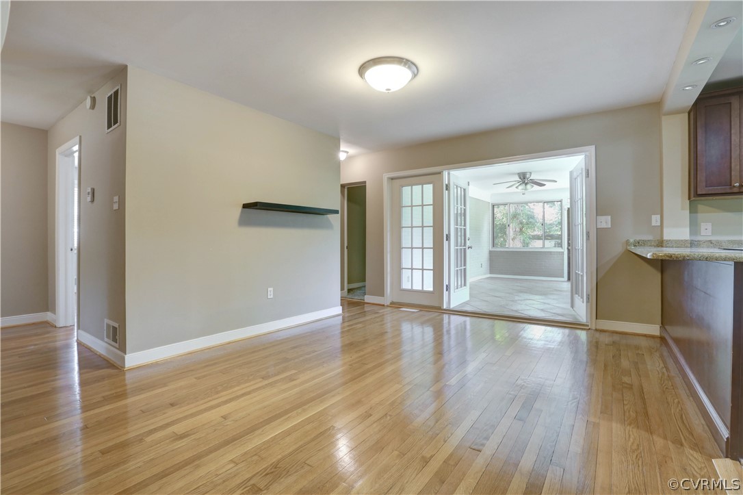 7741 Marilea Road Richmond, VA 23225 - Photo 12 of 44 wooden floor in an empty room with a window