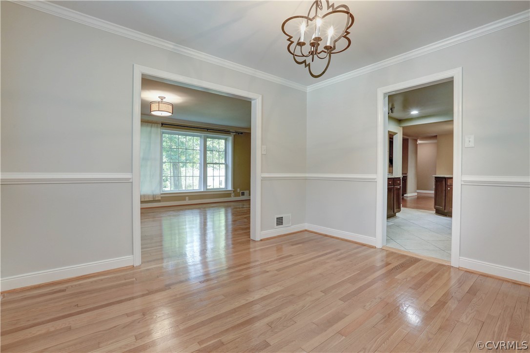 7741 Marilea Road Richmond, VA 23225 - Photo 13 of 44 wooden floor in an empty room with a window