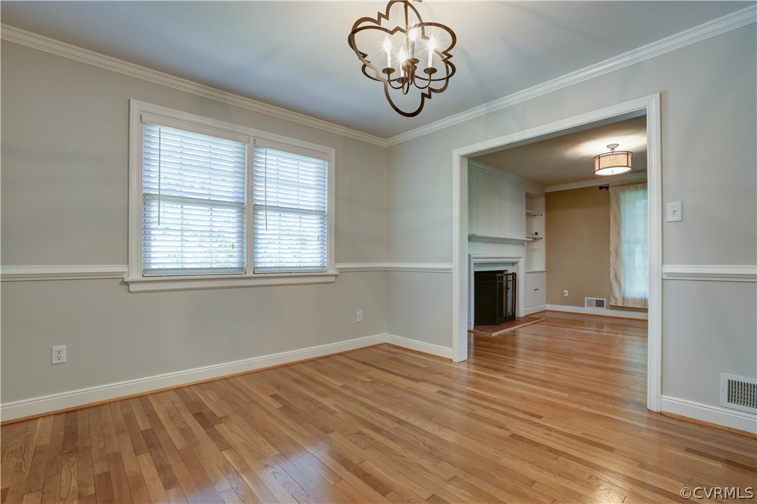 7741 Marilea Road Richmond, VA 23225 - Photo 14 of 44 wooden floor in an empty room with a window