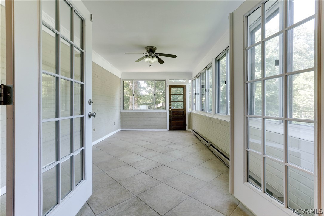 7741 Marilea Road Richmond, VA 23225 - Photo 18 of 44 a view of hallway with windows and chandelier