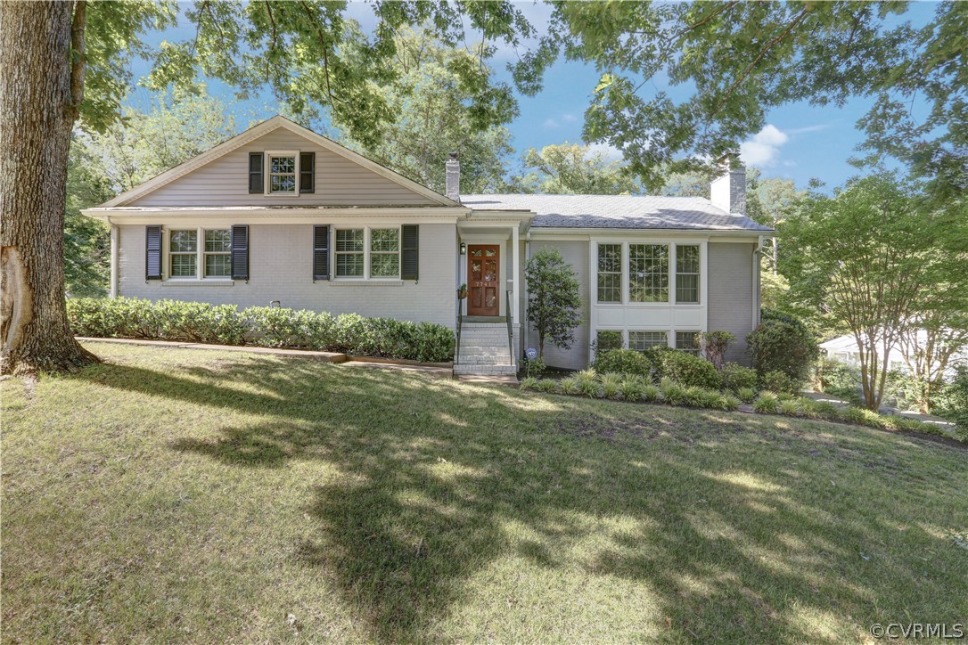 7741 Marilea Road Richmond, VA 23225 - Photo 2 of 44 a front view of a house with a garden