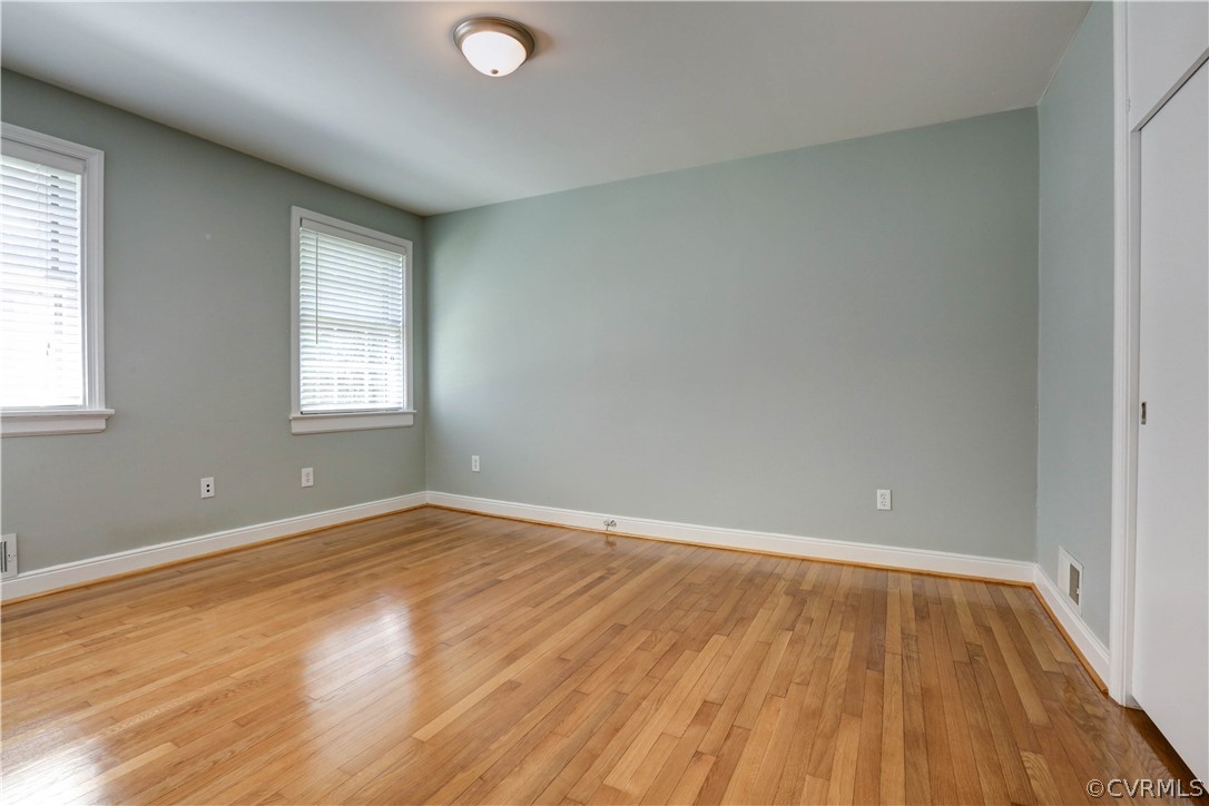 7741 Marilea Road Richmond, VA 23225 - Photo 24 of 44 an empty room with wooden floor and windows