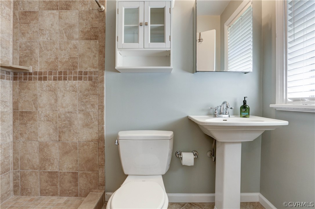 7741 Marilea Road Richmond, VA 23225 - Photo 26 of 44 a bathroom with a toilet sink and mirror