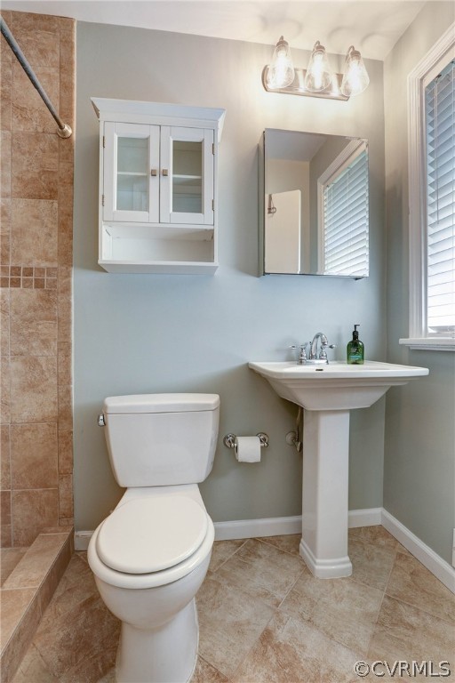 7741 Marilea Road Richmond, VA 23225 - Photo 27 of 44 a bathroom with a sink toilet and mirror