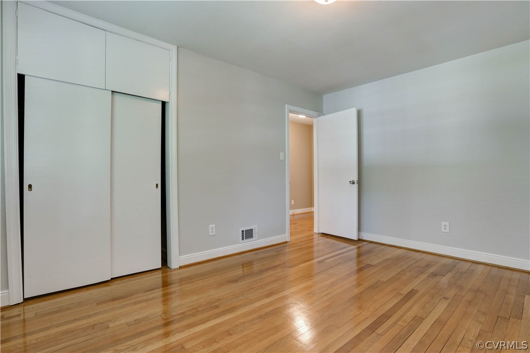 7741 Marilea Road Richmond, VA 23225 - Photo 30 of 44 an empty room with wooden floor and a window