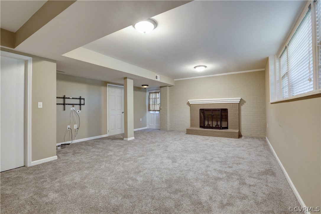 7741 Marilea Road Richmond, VA 23225 - Photo 32 of 44 an empty room with fireplace and a window