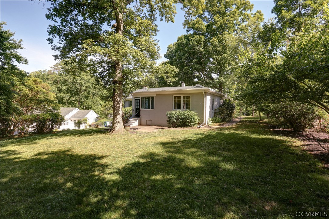 7741 Marilea Road Richmond, VA 23225 - Photo 35 of 44 a front view of house with yard and trees
