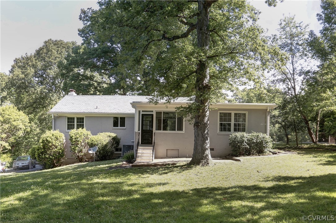 7741 Marilea Road Richmond, VA 23225 - Photo 36 of 44 a front view of house with yard and trees around