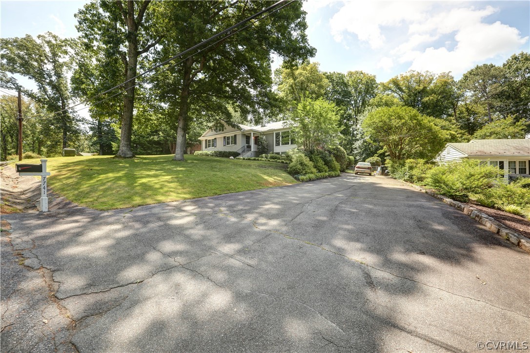 7741 Marilea Road Richmond, VA 23225 - Photo 41 of 44 a view of a house with a big yard and large trees