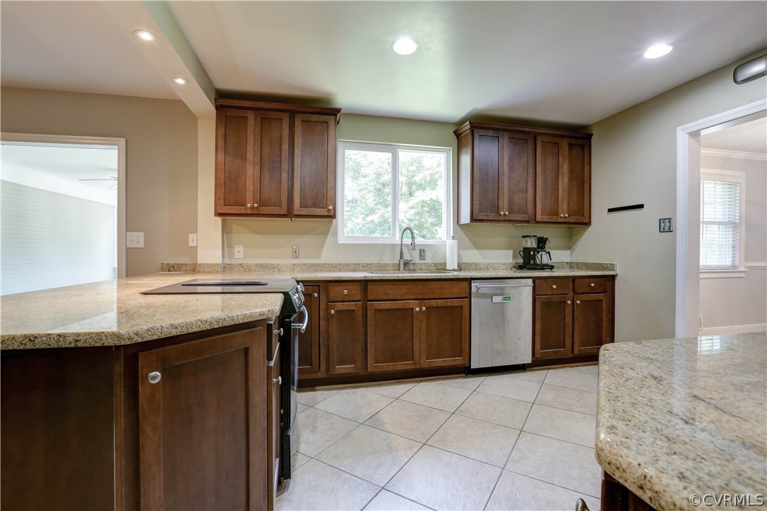 7741 Marilea Road Richmond, VA 23225 - Photo 5 of 44 a kitchen with a stove sink and cabinets