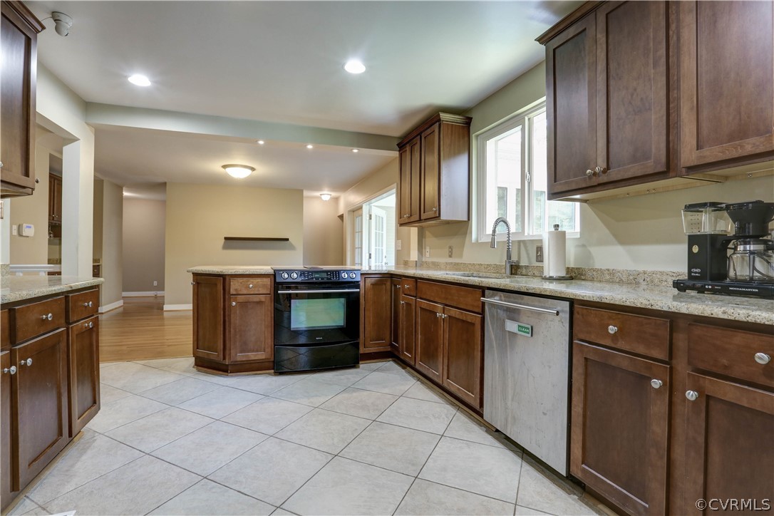 7741 Marilea Road Richmond, VA 23225 - Photo 7 of 44 a kitchen with a sink stove and cabinets