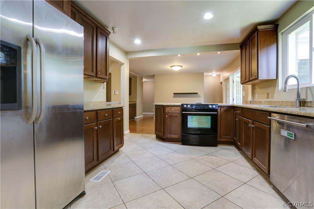 7741 Marilea Road Richmond, VA 23225 - Photo 9 of 44 a kitchen with stainless steel appliances granite countertop a refrigerator and a sink