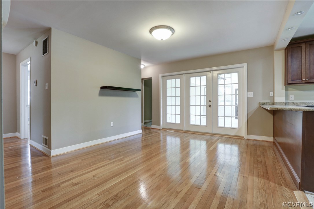 7741 Marilea Road Richmond, VA 23225 - Photo 10 of 44 wooden floor chandelier and windows in a room