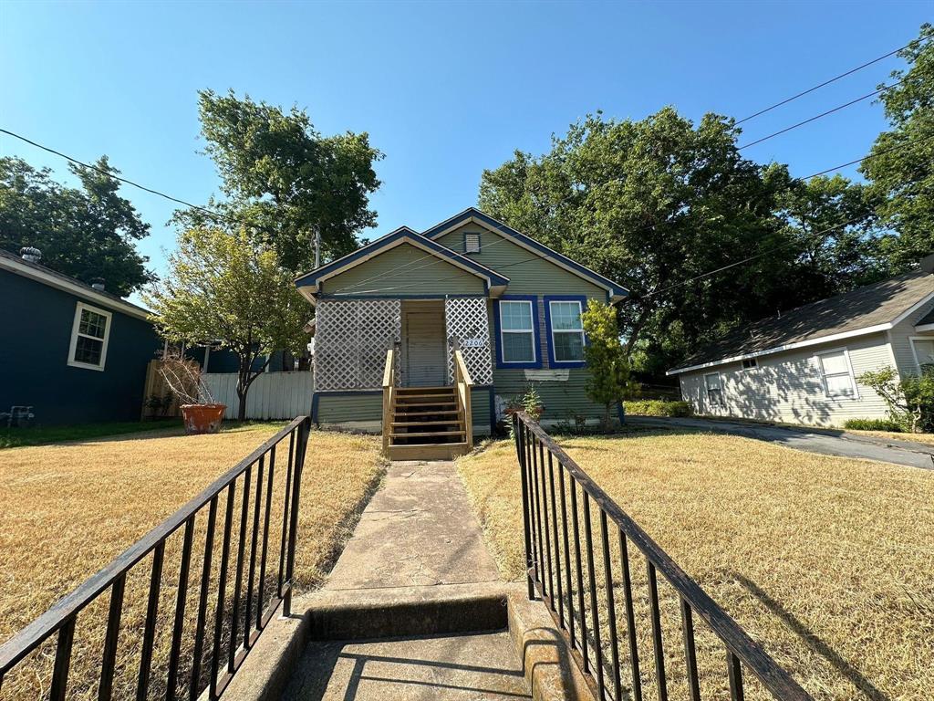 2206 Rockefeller Boulevard Dallas, TX 75203 - Photo 2 of 8 a view of a wooden deck and a garden