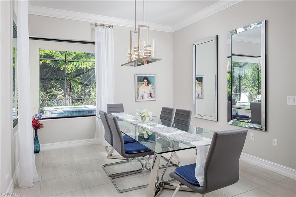 1423 Mockingbird Drive Naples, FL 34120 - Photo 11 of 32 a view of a dining room with furniture window and outside view