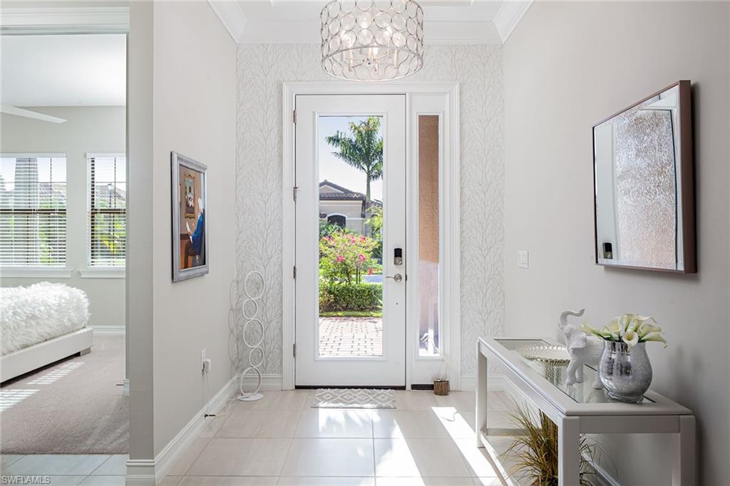 1423 Mockingbird Drive Naples, FL 34120 - Photo 15 of 32 a living room with furniture and a window