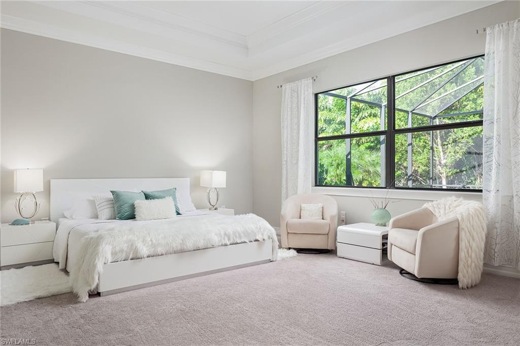 1423 Mockingbird Drive Naples, FL 34120 - Photo 16 of 32 a bedroom with a bed and a large window