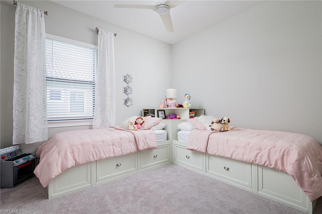 1423 Mockingbird Drive Naples, FL 34120 - Photo 21 of 32 a bedroom with a bed and window