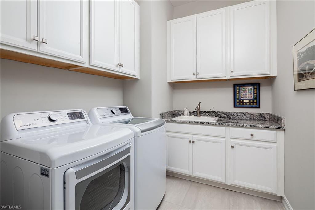 1423 Mockingbird Drive Naples, FL 34120 - Photo 26 of 32 a utility room with dryer and washer