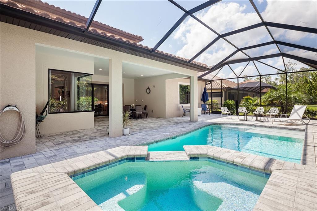 1423 Mockingbird Drive Naples, FL 34120 - Photo 29 of 32 a view of a living room and kitchen