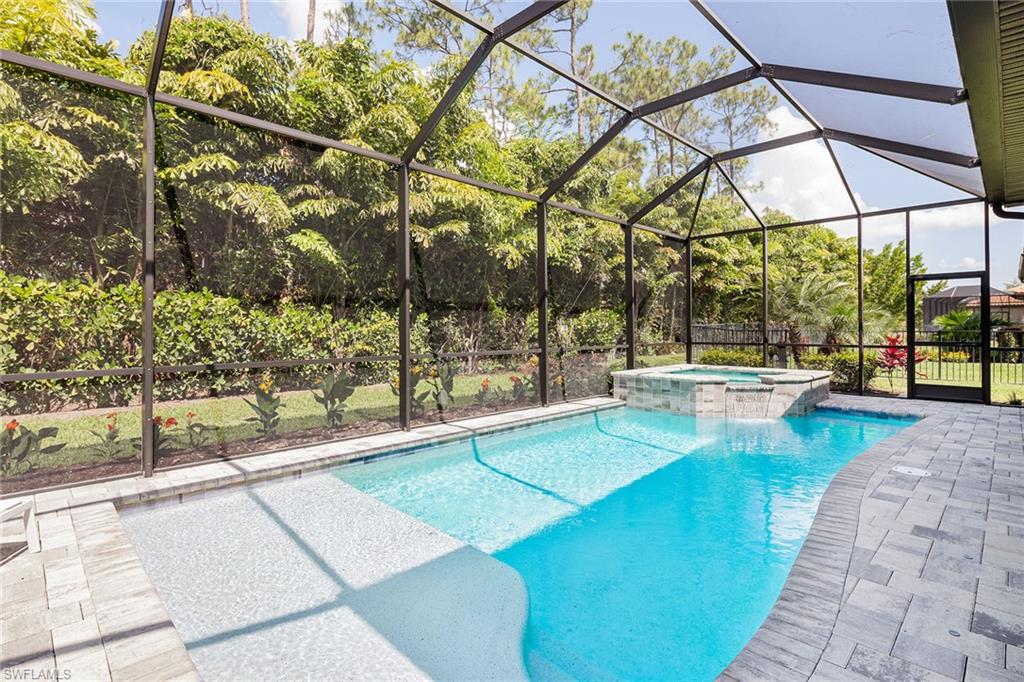 1423 Mockingbird Drive Naples, FL 34120 - Photo 30 of 32 a view of a swimming pool with a patio